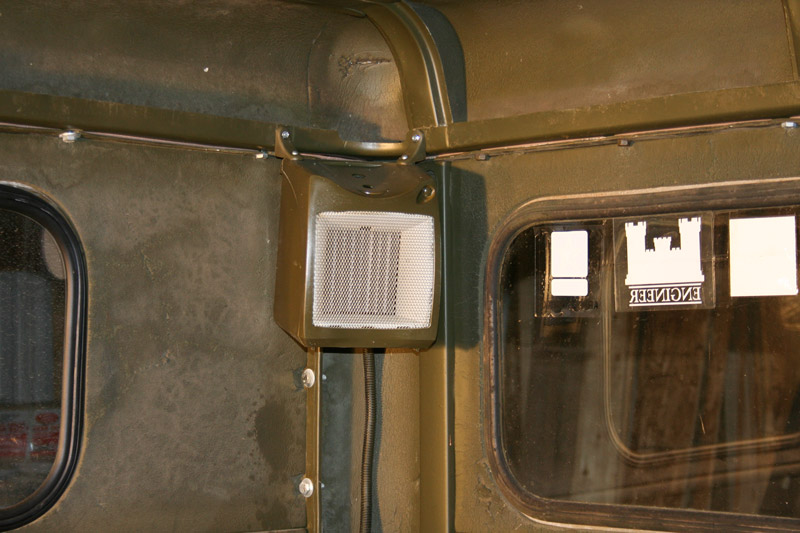 Heater mounted in rear corner of winter cab